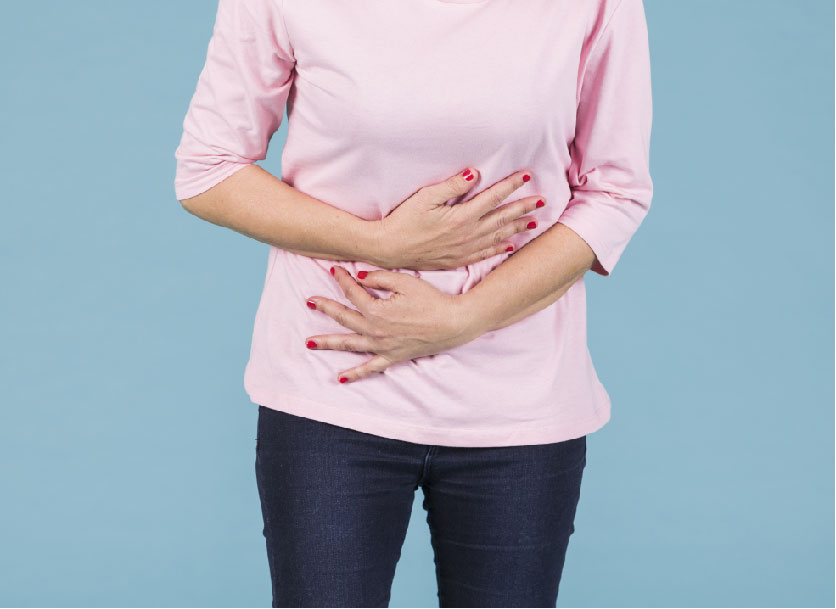 Woman holding lower abdominal in pain